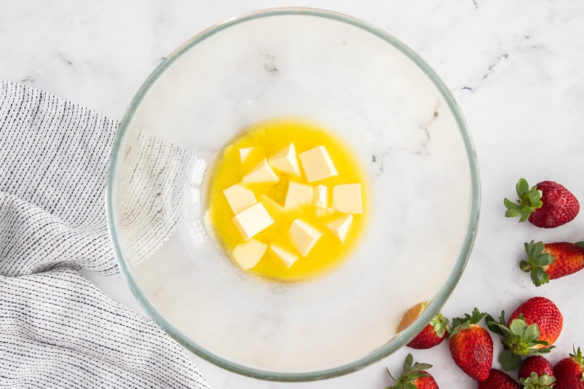 partially melted butter in a glass bowl.