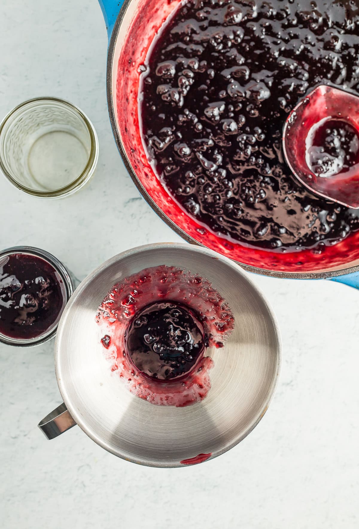 a funnel in a jar filled with jam.