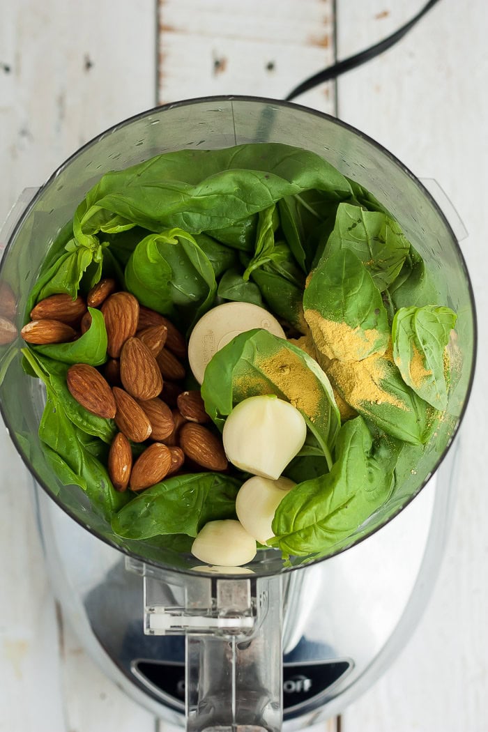basil, garlic, and almonds in a food processor.