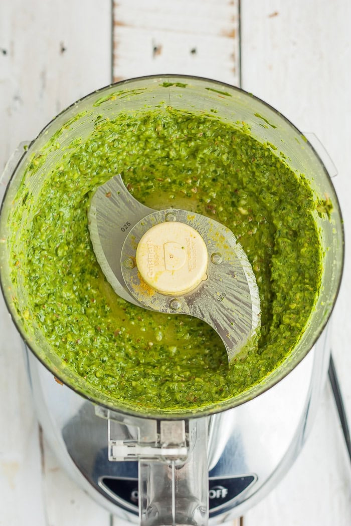 blended pesto ingredients in a food processor.