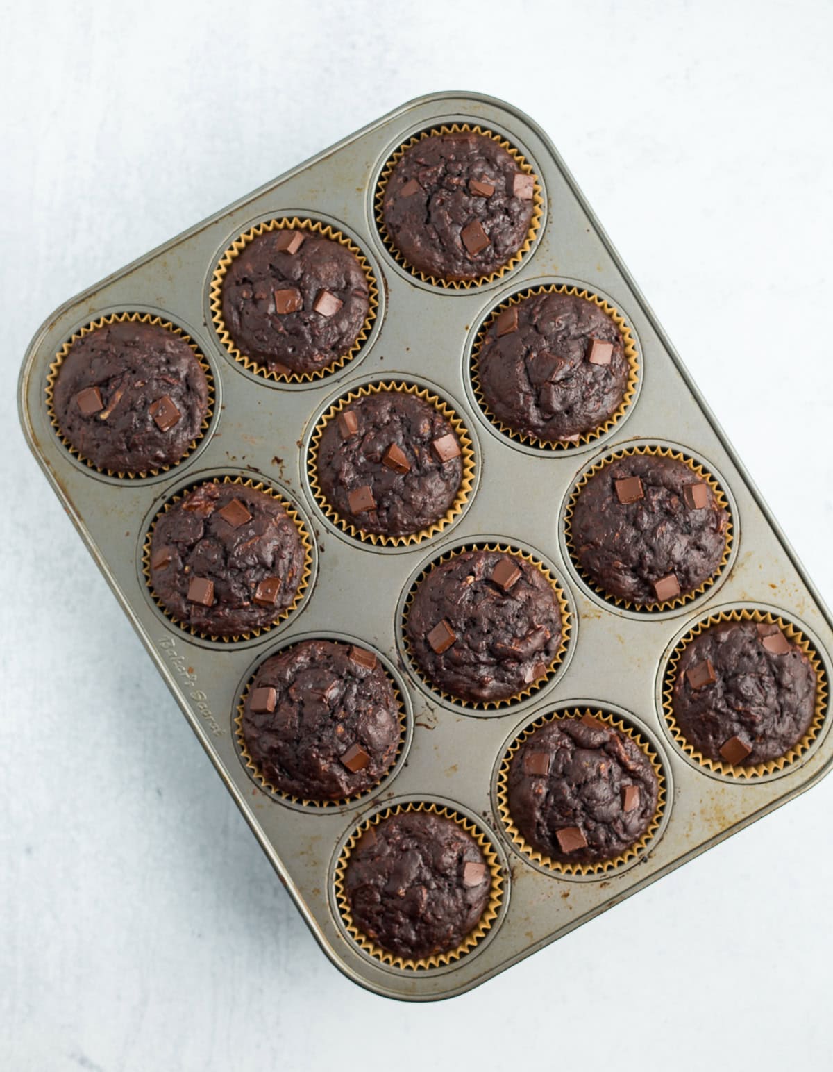 baked banana muffins in a muffin tray.
