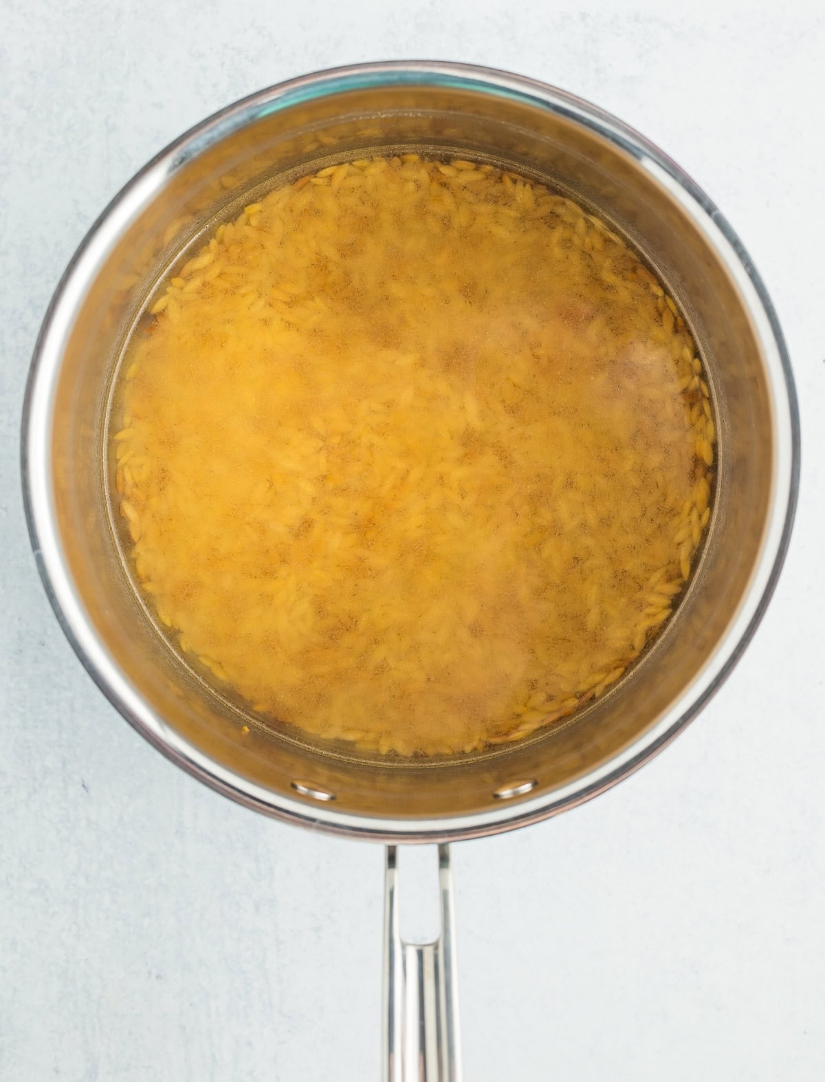 water and pasta in a saucepan.