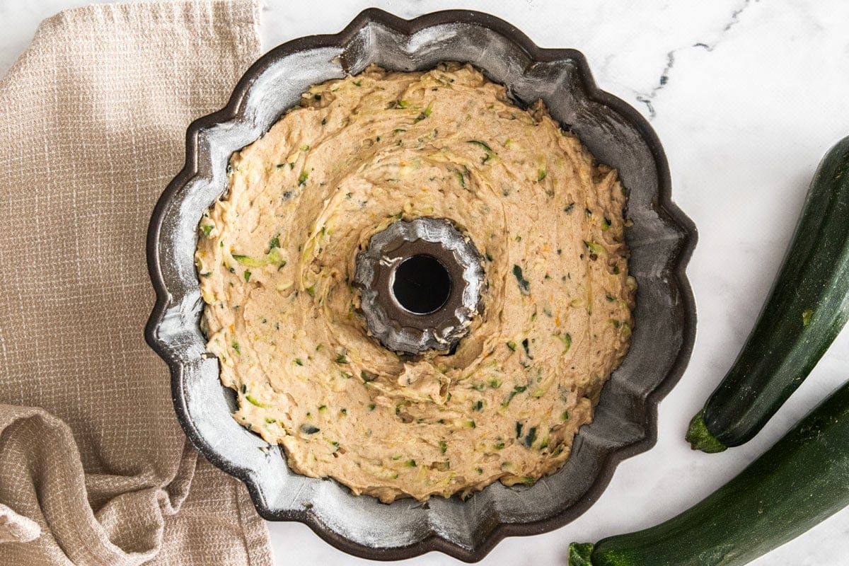 batter in a bundt cake pan.