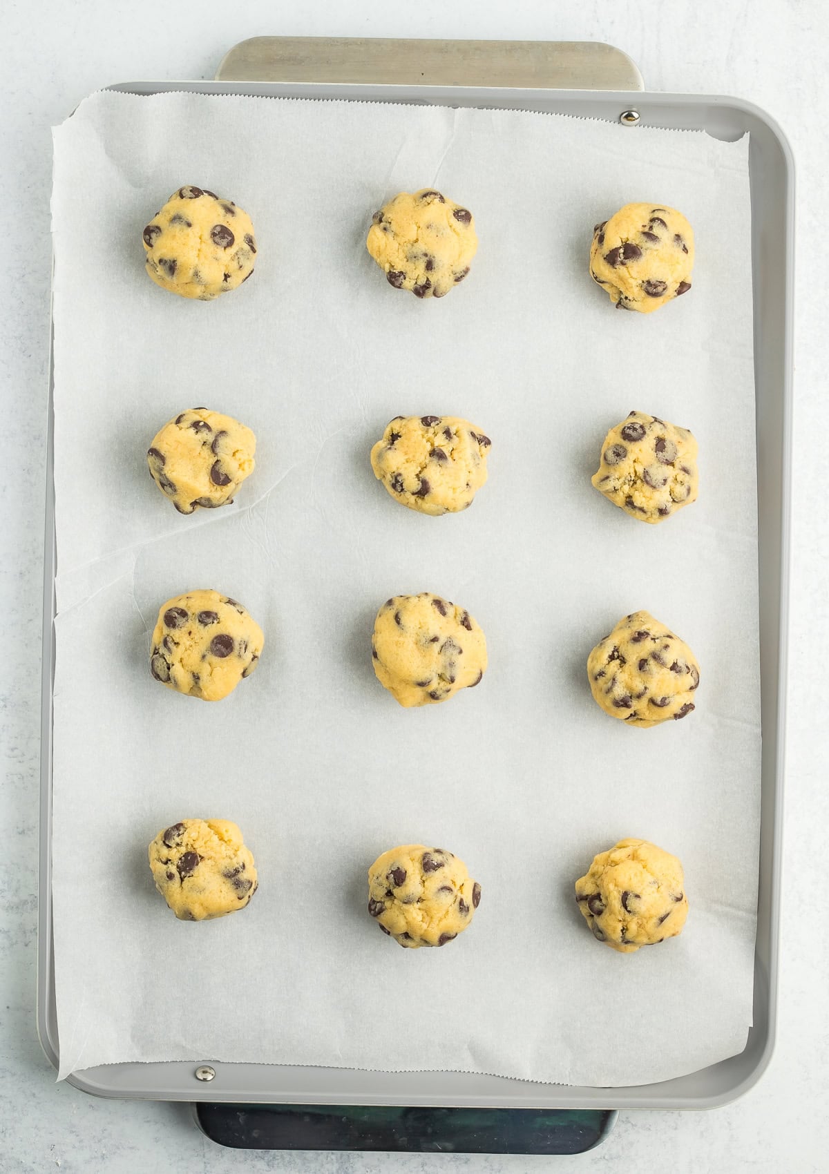 dough balls on a baking sheet.