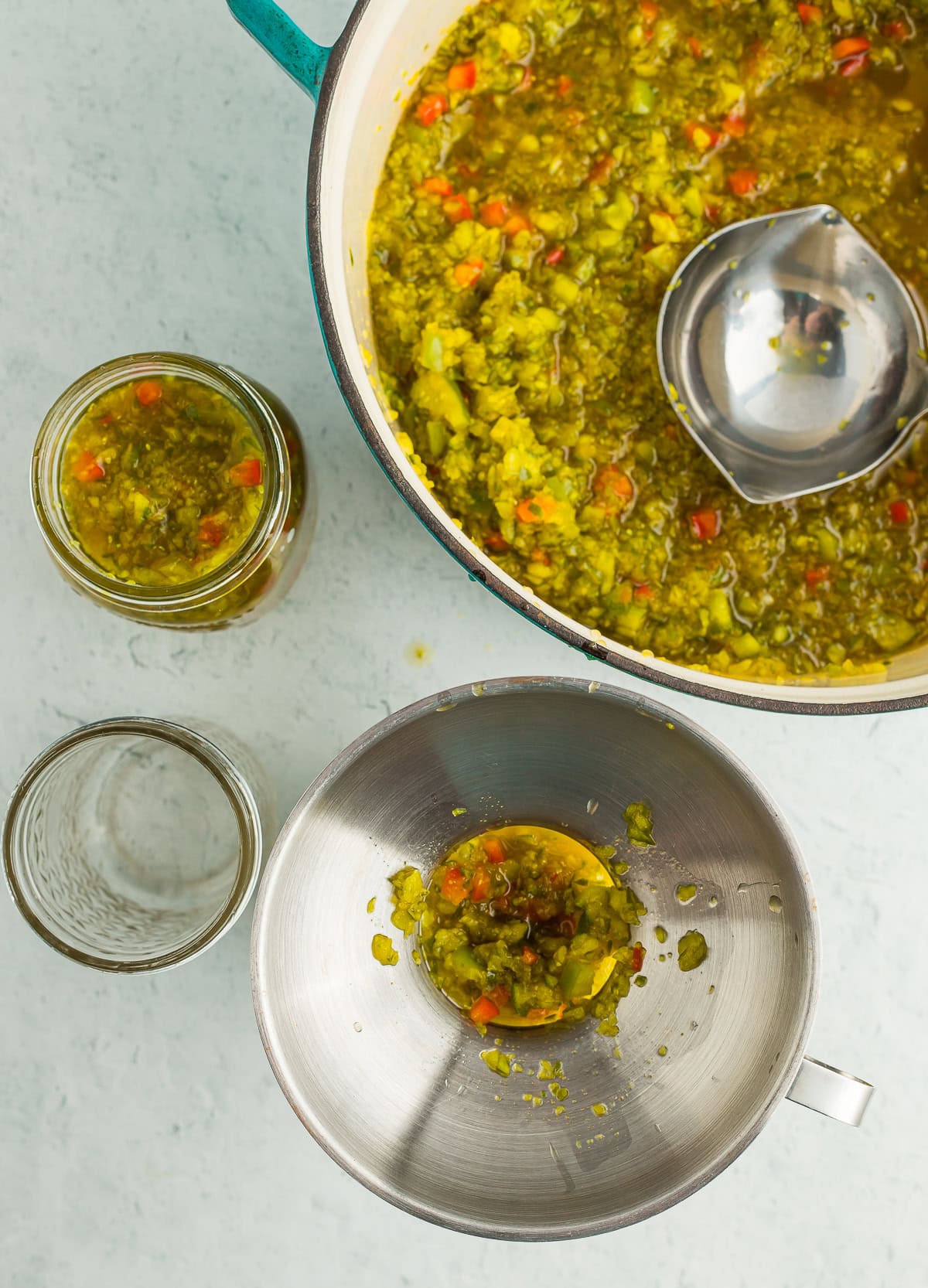 relish in a canning jar and a blue dutch oven.