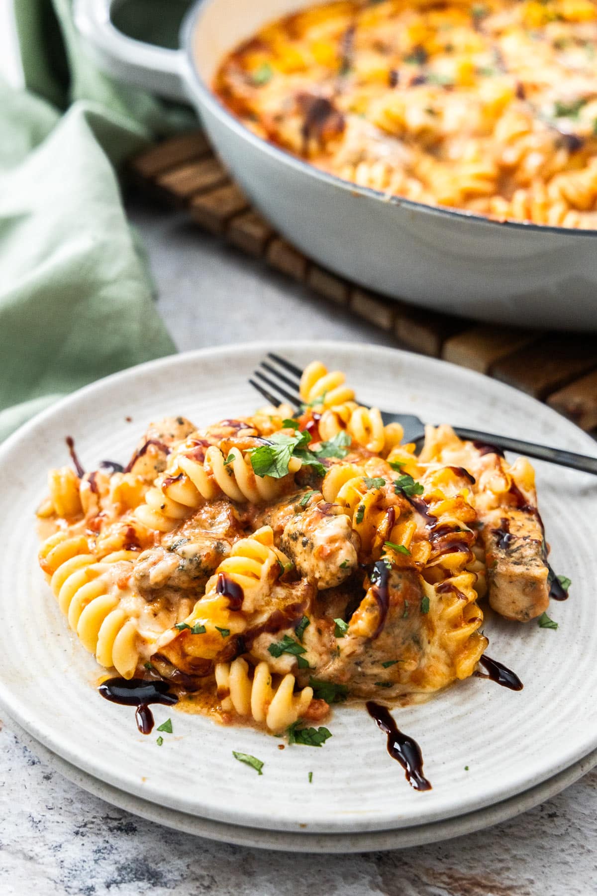 a scoop of pasta casserole on a grey plate.