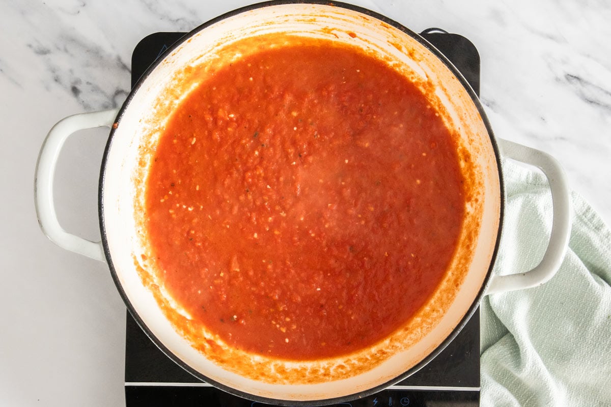 tomato sauce in a white skillet.