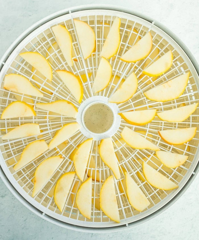 fresh sliced pears on a dehydrator tray.