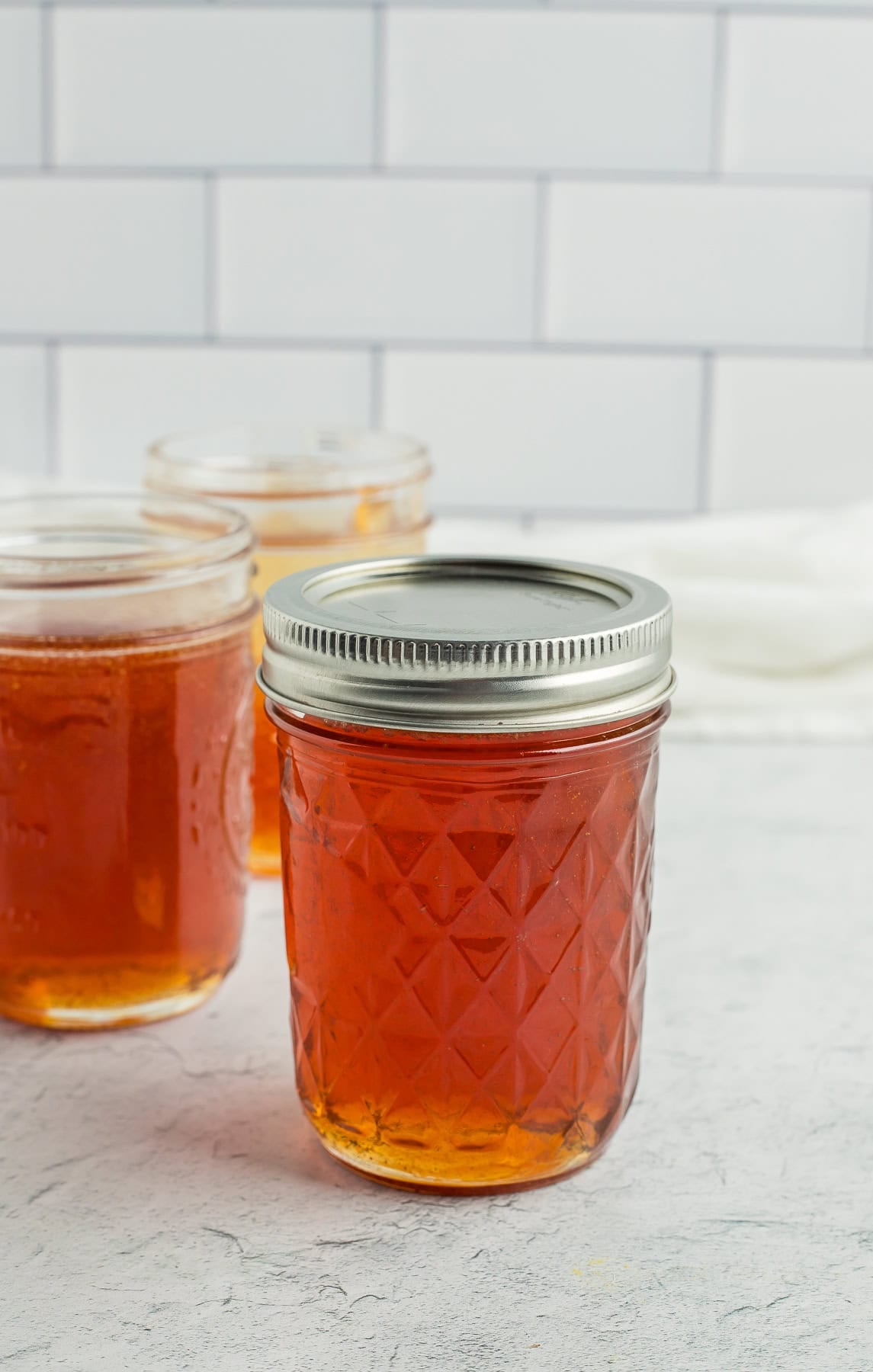 a canning jar with a lid and ring on it.