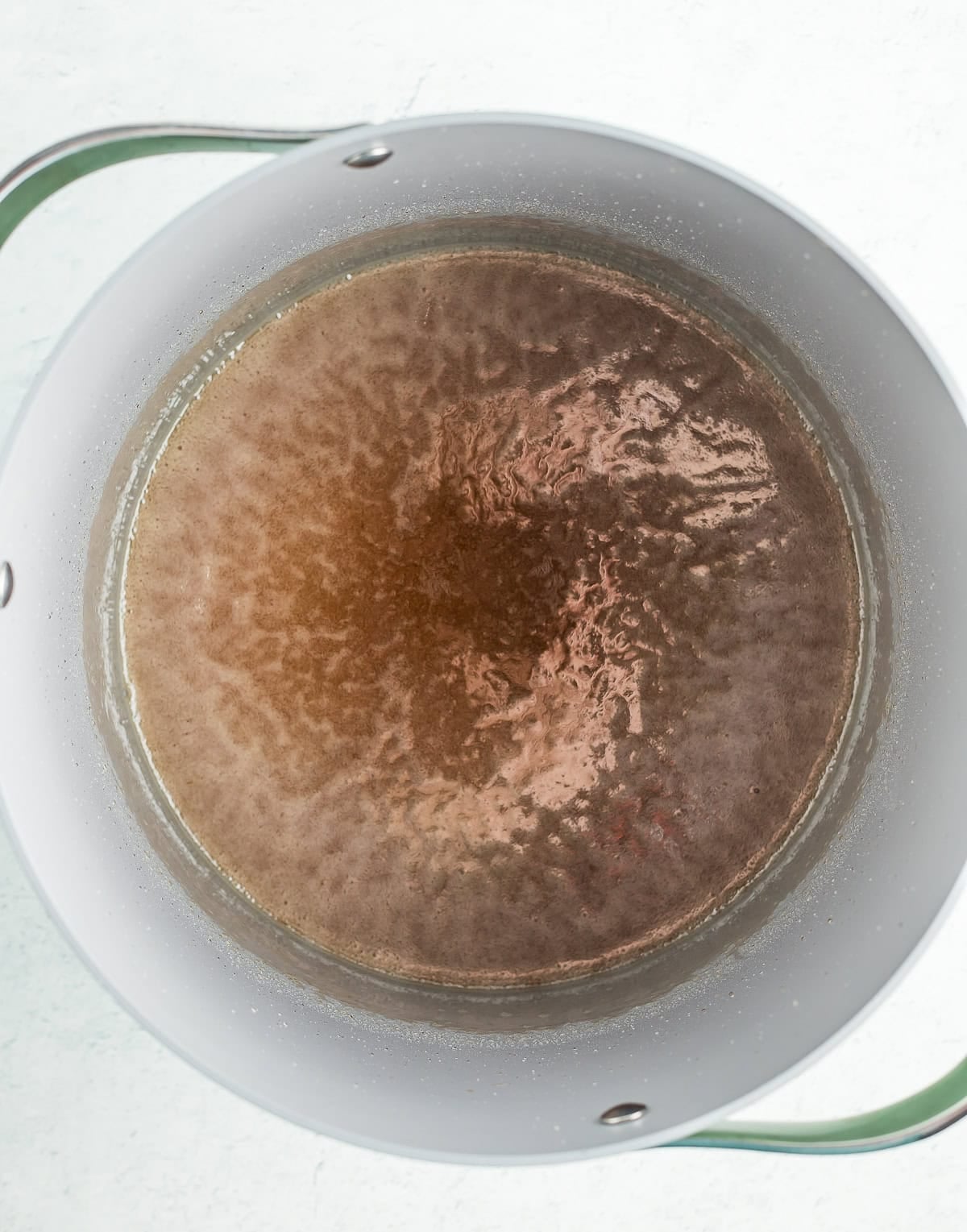 syrup being boiled in a deep stockpot.