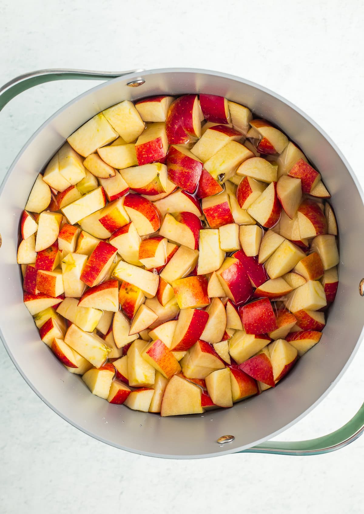 chopped apples in a deep stockpot.