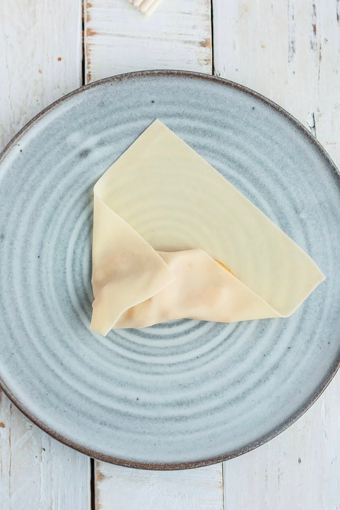 instructions showing how to wrap a dessert egg roll.