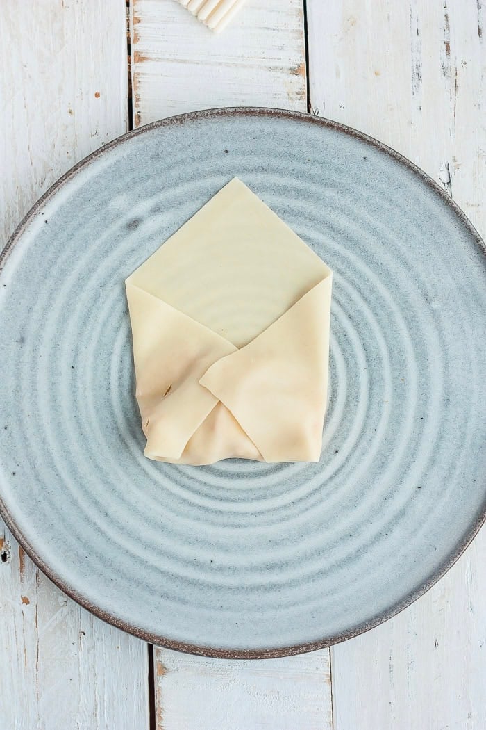 instructions showing how to wrap a dessert egg roll.