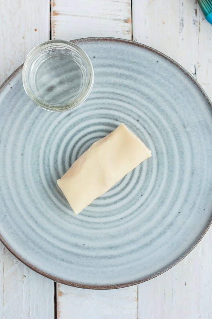 instructions showing how to wrap a dessert egg roll.