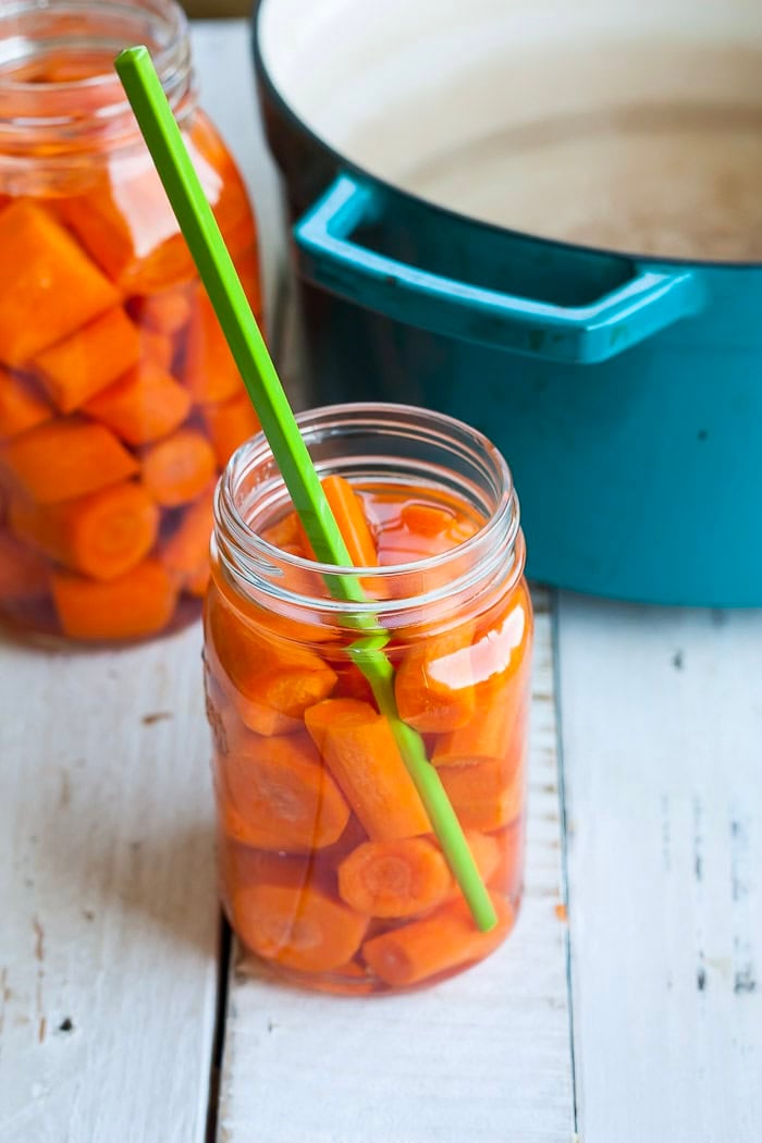 a green chopstick in a canning jar.