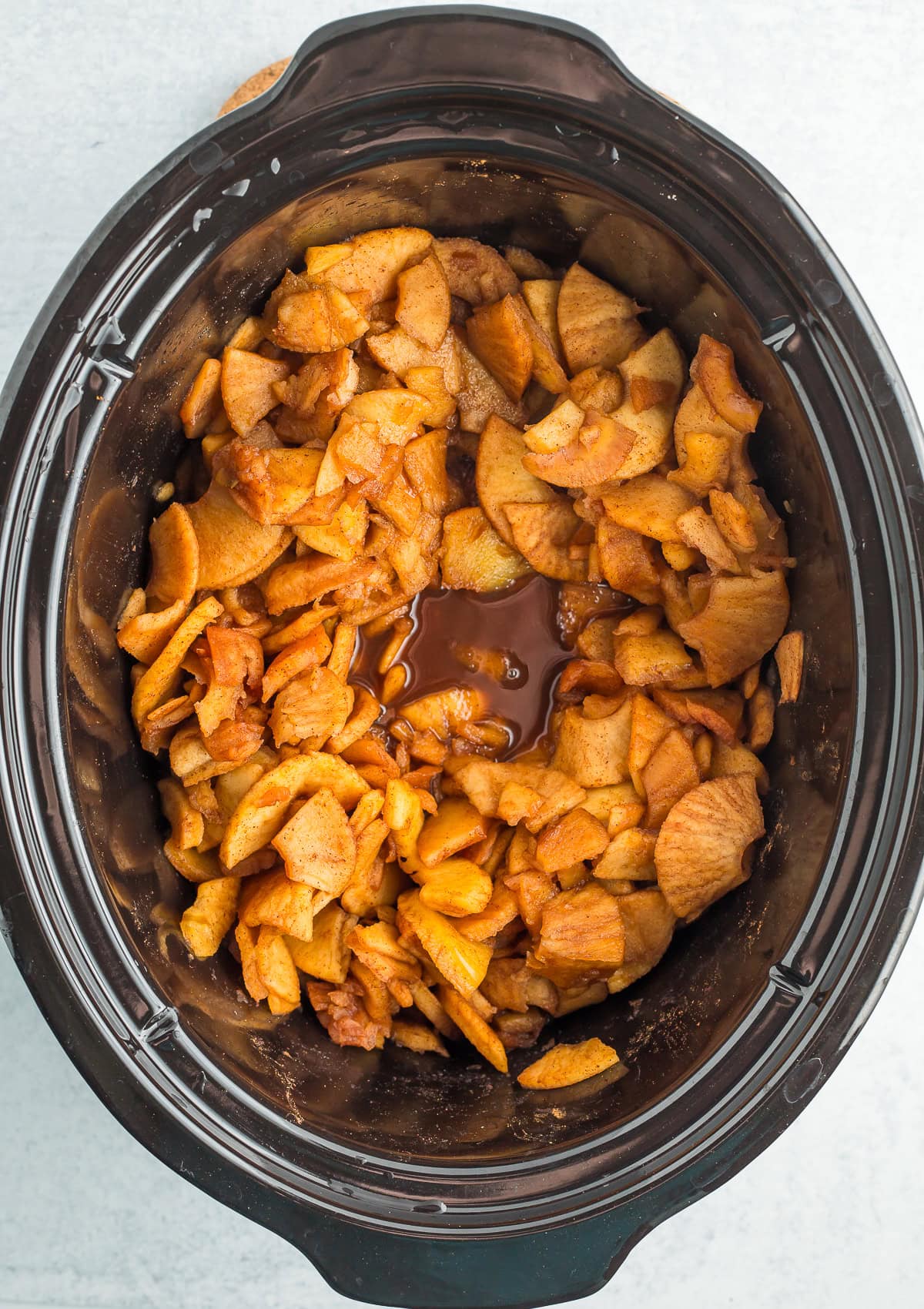 cooking sliced apples in a crockpot.
