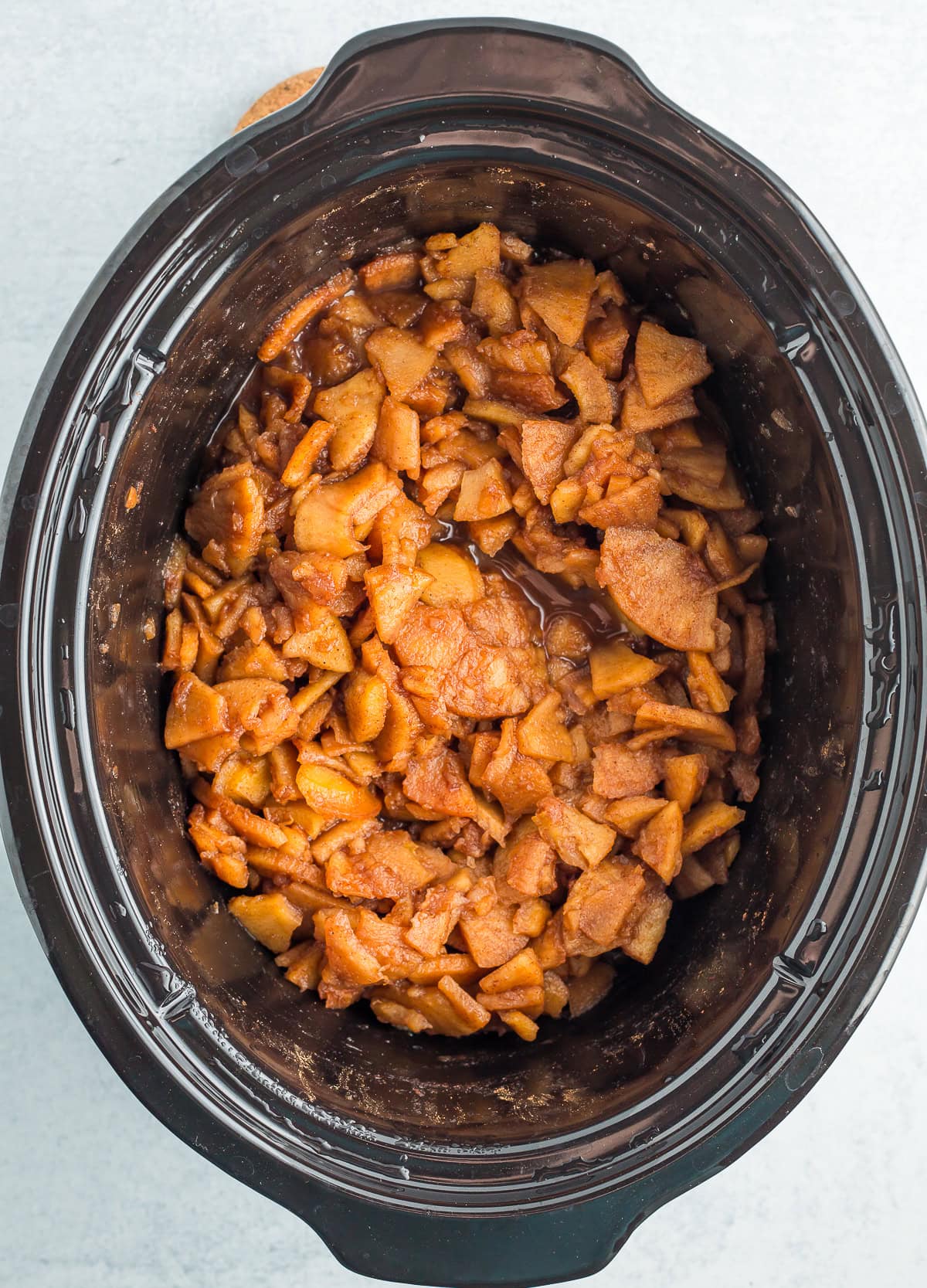 chopped apples in a crockpot.